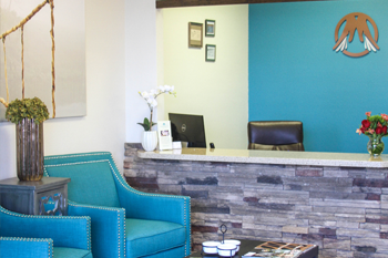 Spa reception area with teal accents and welcoming seating